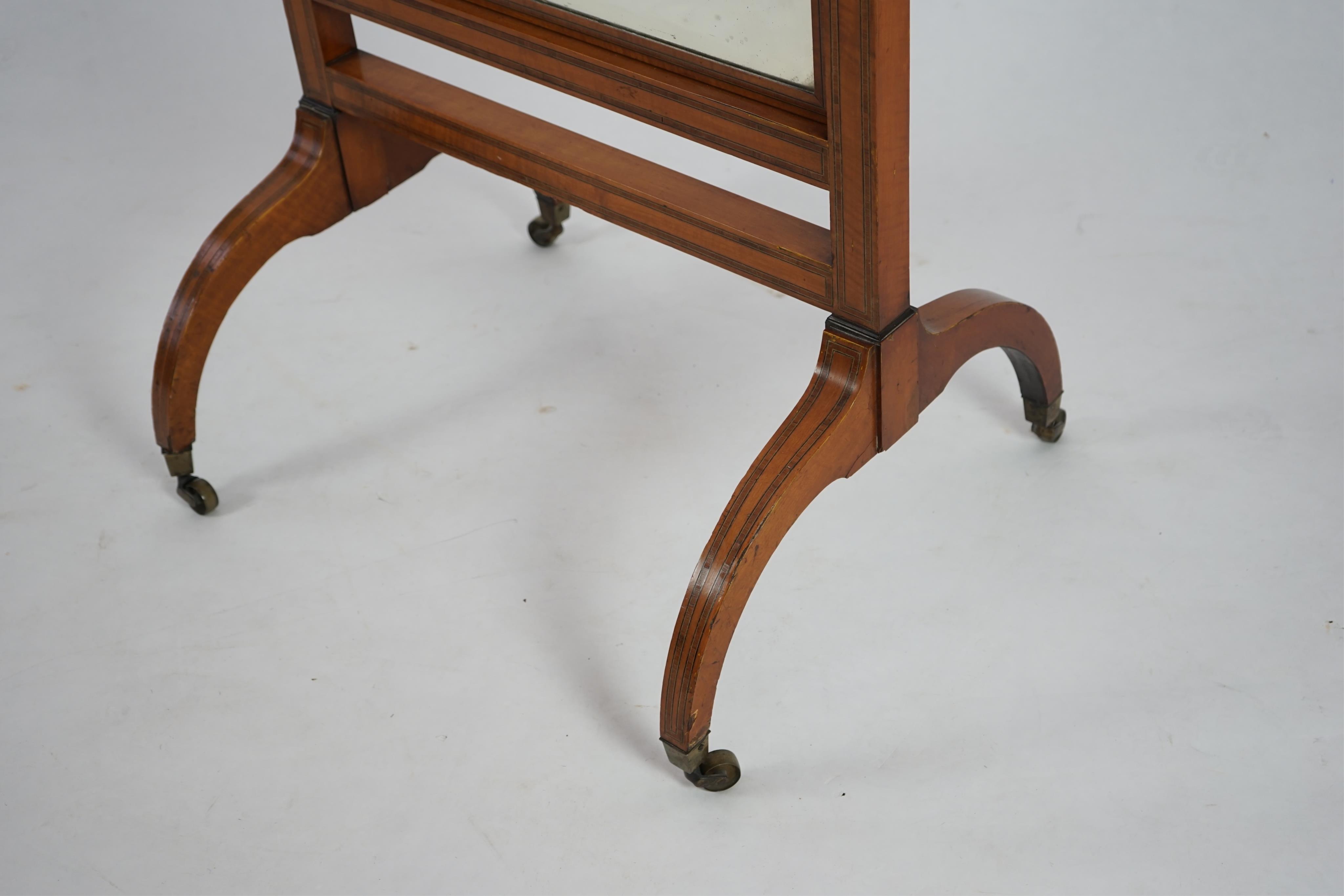 An Edwardian satinwood cheval mirror